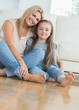 Smiling mother and daughter embracing