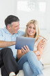 Wife and husband using tablet pc together