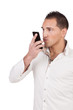 Man blowing a kiss into his mobile phone