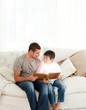Photo: Father and son reading a fairy tale Father and son reading a fairy tale
