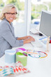 Smiling interior designer working on her computer