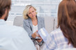 Photo: Therapist giving tissue to a woman Therapist giving tissue to a woman