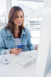 Smiling woman purchasing online with a credit card