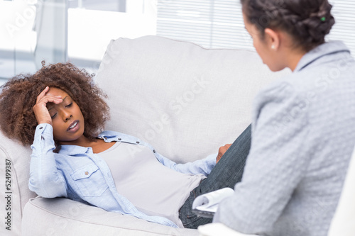 Photo: Woman on sofa telling her problems Woman on sofa telling her problems