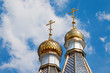 golden dome of church on blue sky background