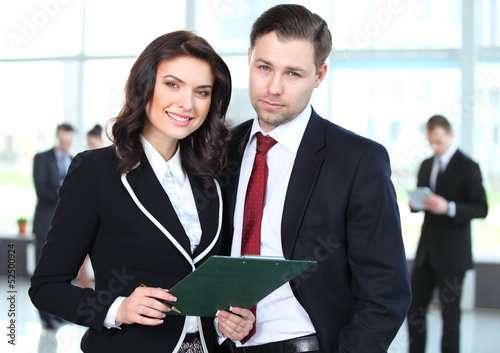 Photo: Image of two business partners planning work Image of two business partners planning work