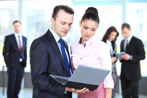 Photo: Image of two business partners planning work Image of two business partners planning work
