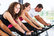 Group of People Cycling at Gym