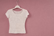 Transparent white blouse is on hanger.