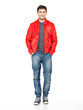 Photo: Smiling happy man in red jacket, blue jeans and gymshoes. Smiling happy man in red jacket, blue jeans and gymshoes.