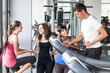 Attractive Man at Gym with Three Women