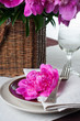table setting with pink peonies, vintage cutlery and brown table
