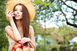 Beautiful woman in the garden with apples