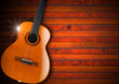 Acoustic Guitar on Wood Background