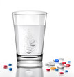farbige Tabletten und Wasserglas