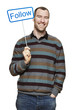 Young man holding a social media sign smiling