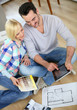 Photo: Couple looking at new home construction plan Couple looking at new home construction plan