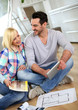 Couple looking at new home construction plan