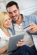 Couple shopping on internet with credit card