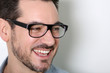 Foto: Portrait of cheerful man with eyeglasses on Portrait of cheerful man with eyeglasses on
