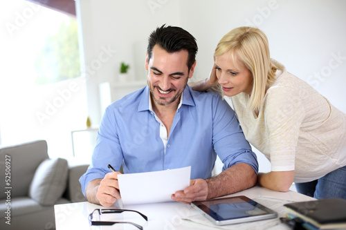 Photo: Middle-aged couple working from home Middle-aged couple working from home