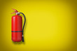 Fire extinguisher on the yellow wall