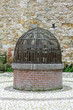 ancient medieval pit in a courtyard of a castle of the Lords of