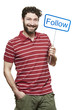 Young man holding a social media sign smiling