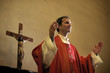 Catholic priest on altar praying during mass