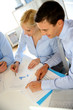 Foto: Upper view of business people meeting around table Upper view of business people meeting around table