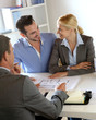 Couple meeting construction planner