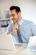 Smiling businessman working in office