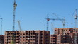 House construction with cranes. Time lapse