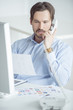 Photo: Businessman working at the desk Businessman working at the desk
