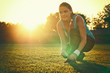 Young woman preparing to run
