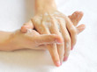 Washing woman hands on a background a white towel