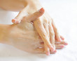 Washing woman hands on a background a white towel