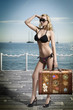 sexy blonde tourist with vintage bag