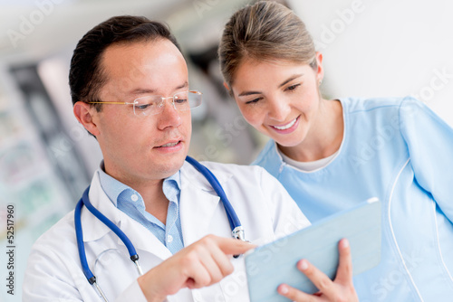 Photo: Doctor talking to a nurse Doctor talking to a nurse
