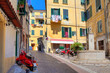 Photo: Small plaza among colorful houses in Ventimiglia, Italy. Small plaza among colorful houses in Ventimiglia, Italy.