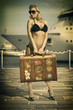 pretty girl ready to travel waiting for the ship