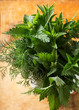 Fresh organic herbs on wooden table