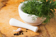 Fresh organic herbs on wooden table