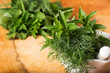 Fresh organic herbs on wooden table