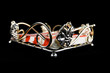 Napkin holder with red and white napkin over black background
