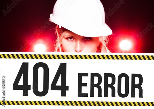 Photo: Worker holding 404 error sign on information board Worker holding 404 error sign on information board
