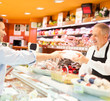 Shopkeeper serving a customer