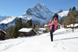 Girl with a camera in Swiss Alps