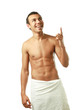Photo: A nude young man covering himself with a towel A nude young man covering himself with a towel