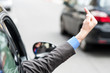 Man showing middle finger from car window